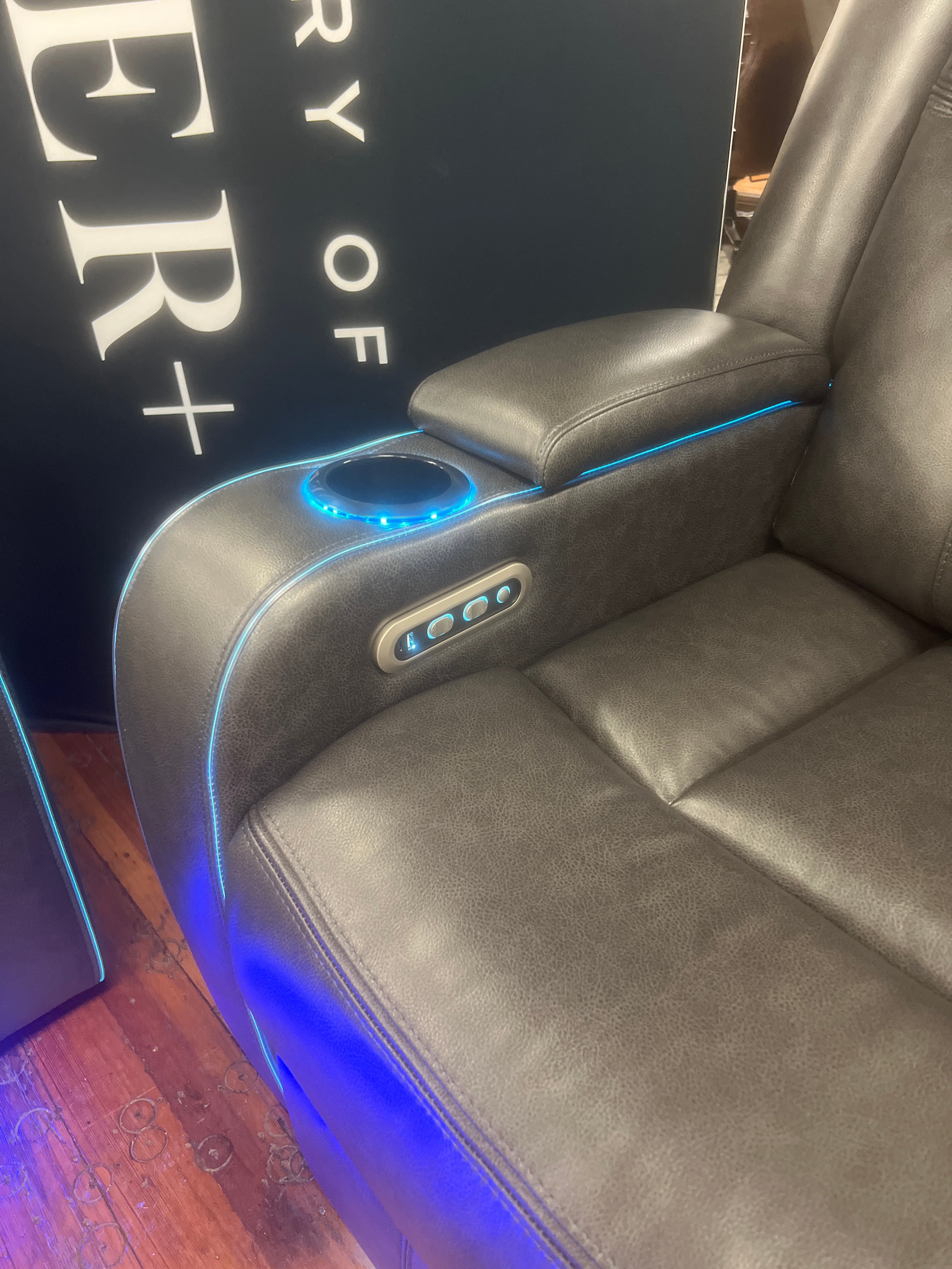 Charcoal Reclining Sofa & Loveseat with sound system and ambient lighting